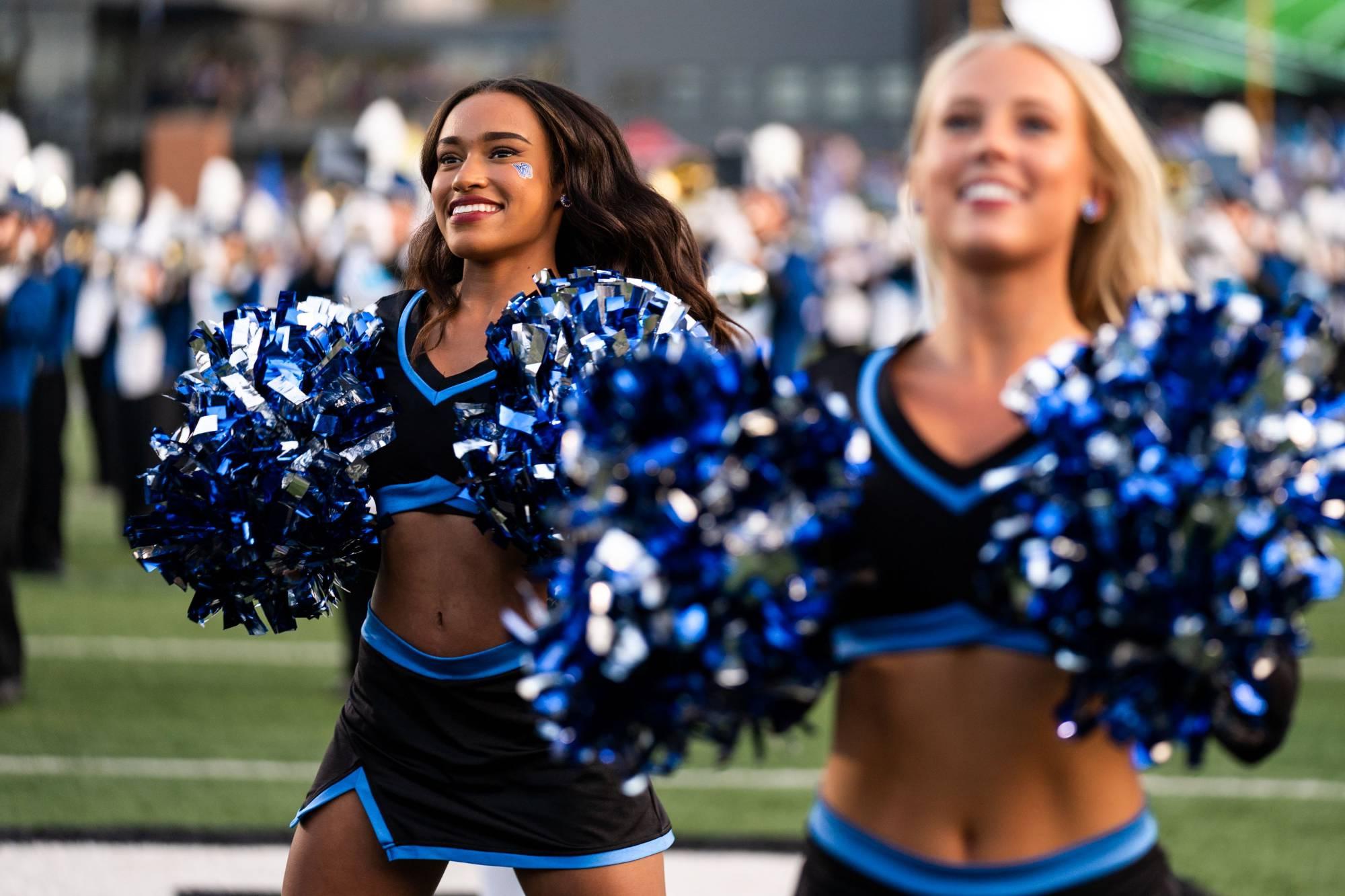 Laker Dance Team members cheer on the football team during a game